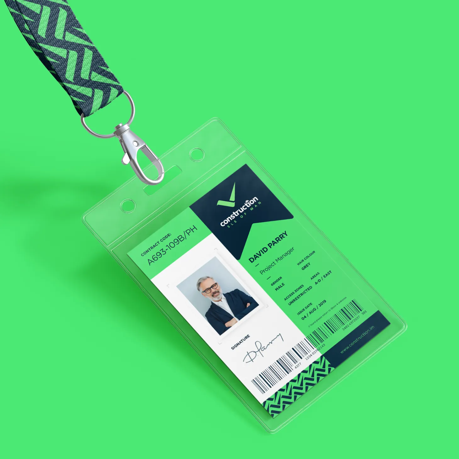 A Construction Isle of Man accreditation ID card on a branded lanyard, showing a sample card for David Parry, Project Manager, with accreditation code, photo, and certification dates, designed by DotPerformance